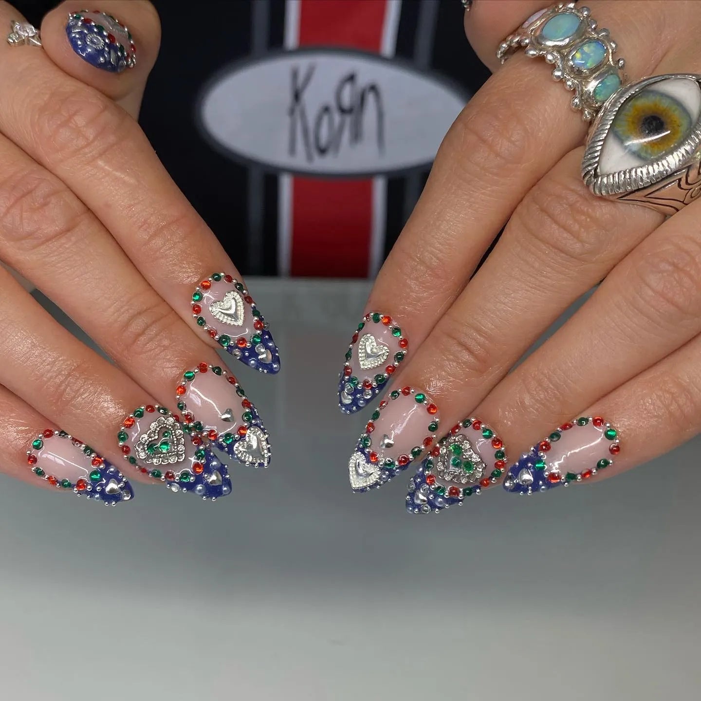 Handmade royal blue ombre heart press-on nails with silver chrome and gemstone accents