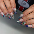 Handmade royal blue ombre press-on nails with silver heart gems and colorful rhinestones