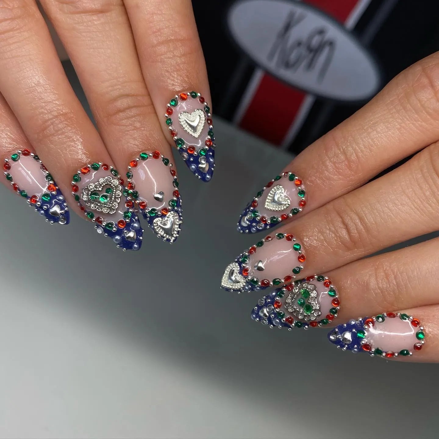 Handmade royal blue ombre press-on nails with silver heart gems and colorful rhinestones