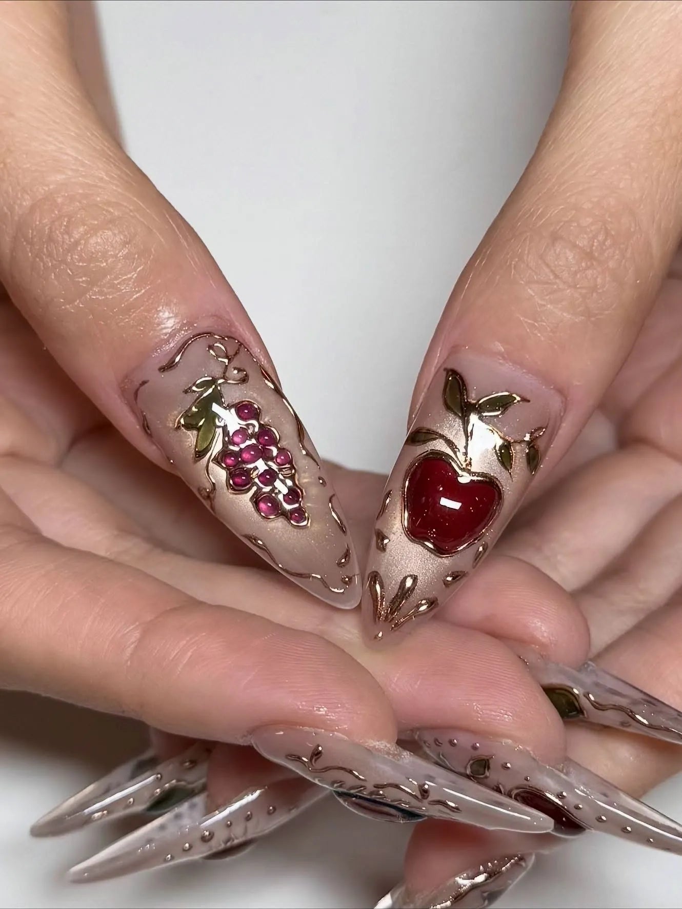Handmade press-on stiletto nails with 3D fruit, gemstone accents, and golden filigree details