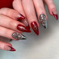 Handmade red and silver press-on nails with cross and heart gothic French art designs.