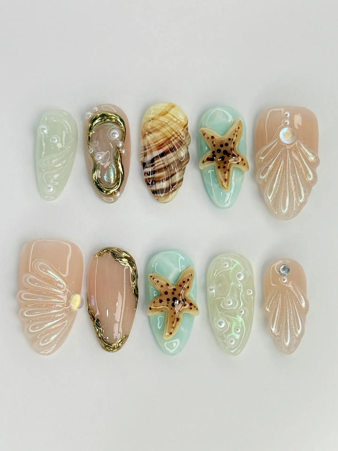 Handmade press-on nails with 3D seashell, starfish, and ocean beach designs