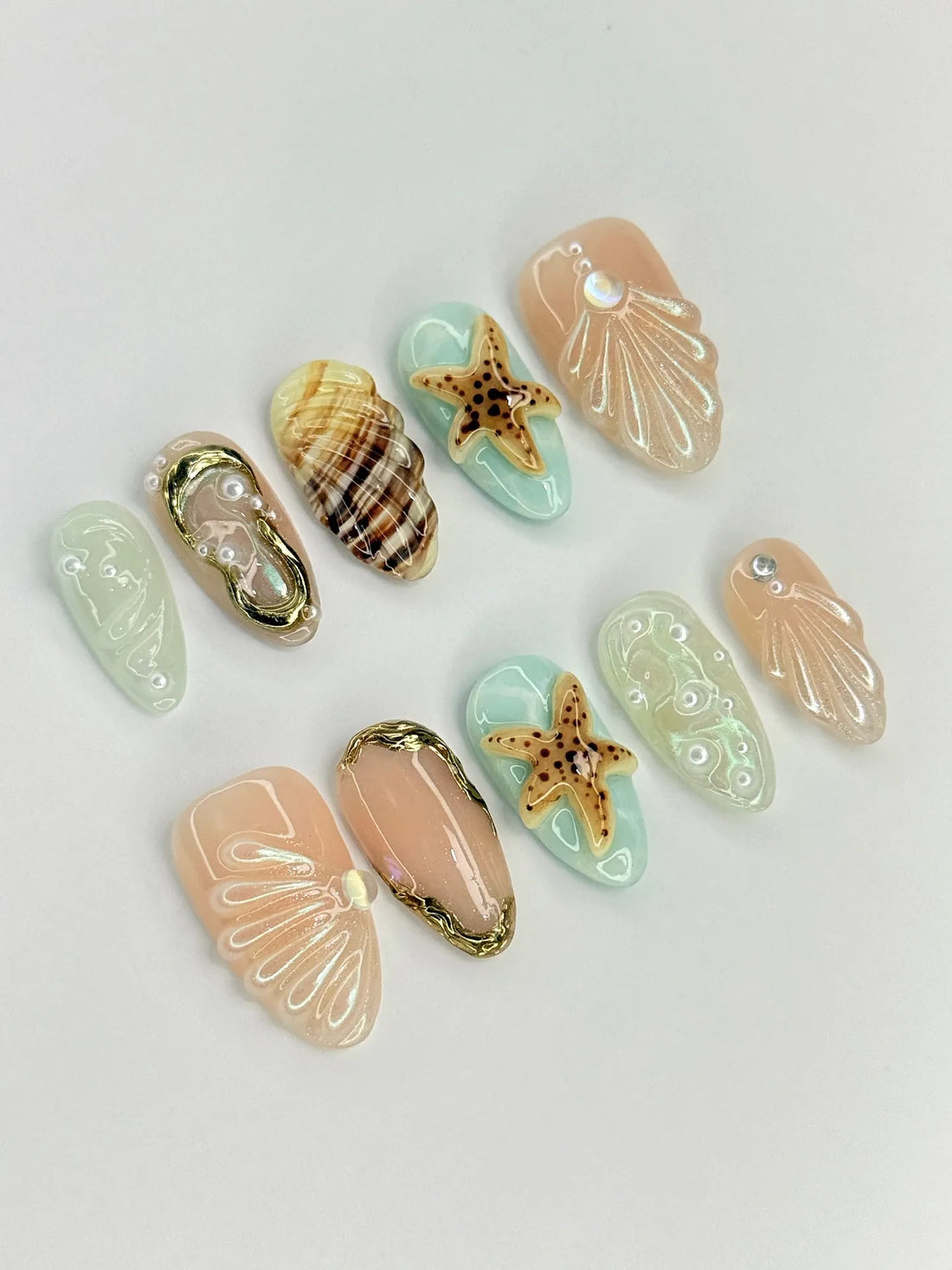 Handmade press-on nails with 3D seashell, starfish, and ocean beach designs