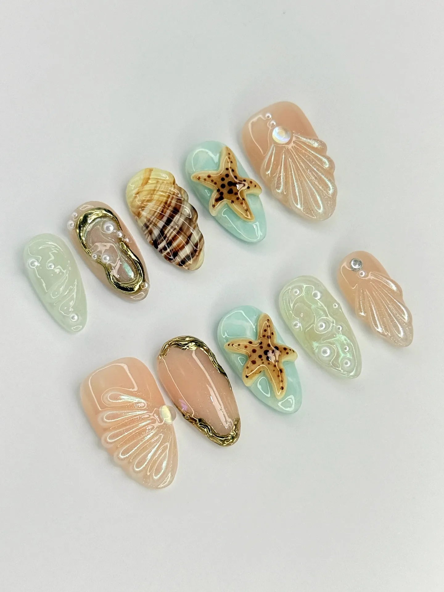 Handmade press-on nails with 3D seashell, starfish, and ocean beach designs