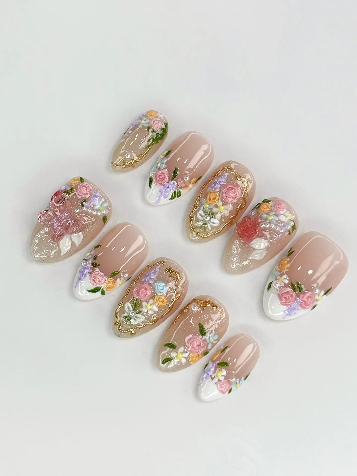 Handmade press-on nails with 3D floral rose designs, pearls, gold filigree, and shimmer accents