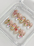 Handmade press-on nails with 3D floral rose designs, pearls, and gold filigree accents