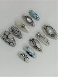 Handmade silver metallic cyber shell liquid chrome press-on nails with unique 3D designs