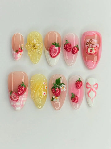 Handmade press-on nails with 3D strawberries, floral accents, gingham, jam jar, and pink bows.