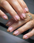 Handmade press-on nails with autumn botanical floral design on a nude base