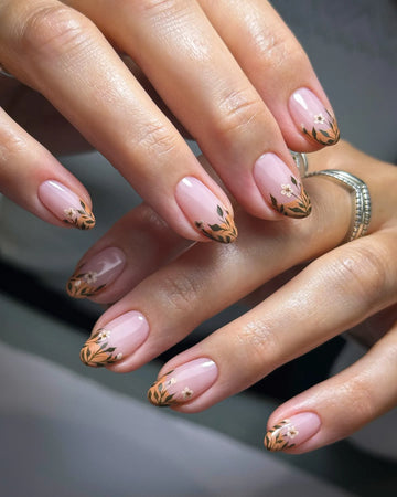Handmade press-on nails with autumn botanical floral design on a nude base