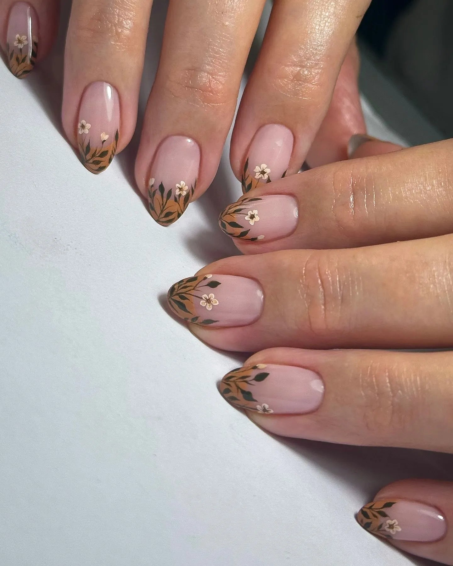 Handmade autumn botanical press-on nails with floral garden design on nude base
