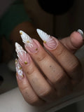 White 3D shell floral bridal press-on nails with gold studs and intricate designs